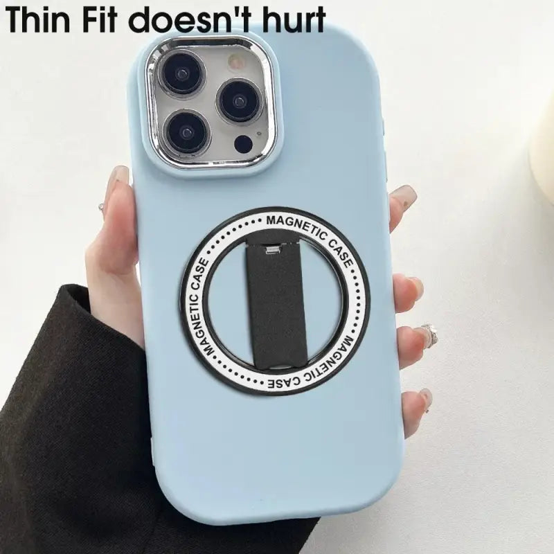 a person holding a phone case with a camera