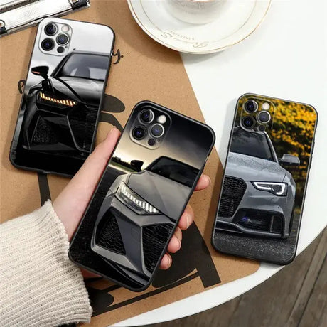 A person holding a phone case with a car design on it