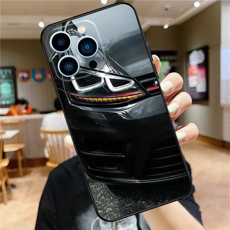 a person holding a phone case with a car design on it