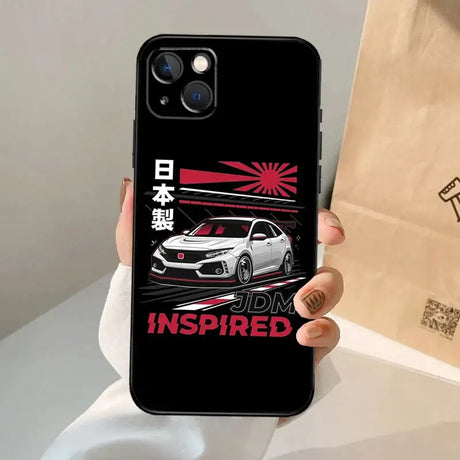 A person holding a phone case with a car