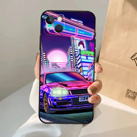 A person holding a phone case with a car on it