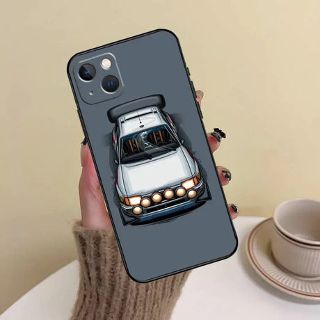 A person holding a phone case with a car on it