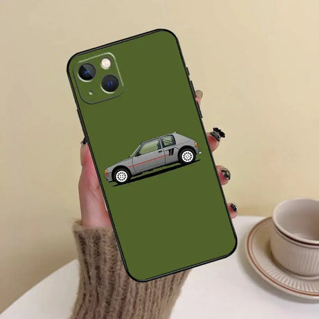 A person holding a phone case with a car on it