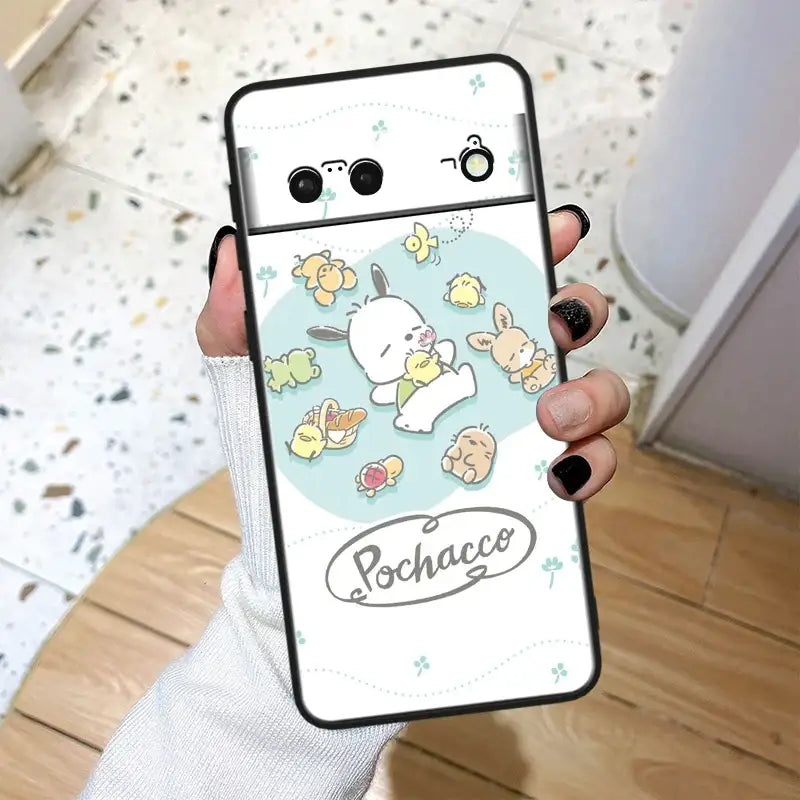 A person holding a phone case with a cartoon character