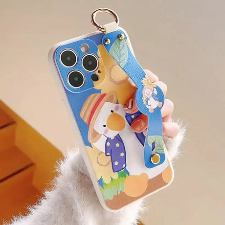 A person holding a phone case with a cartoon character on it