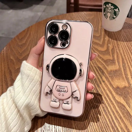 A person holding a phone case with a cartoon character on it