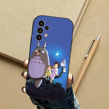 A person holding a phone case with a cartoon character