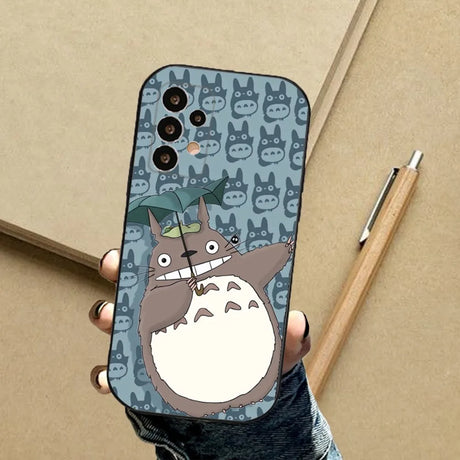 A person holding a phone case with a cat on it