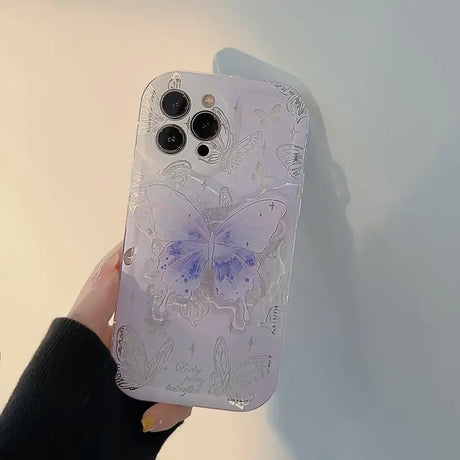 A person holding a phone case with a flower design