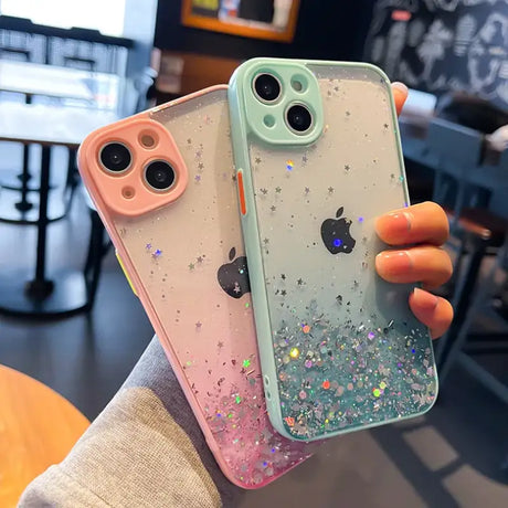 A person holding a phone case with glitter on it