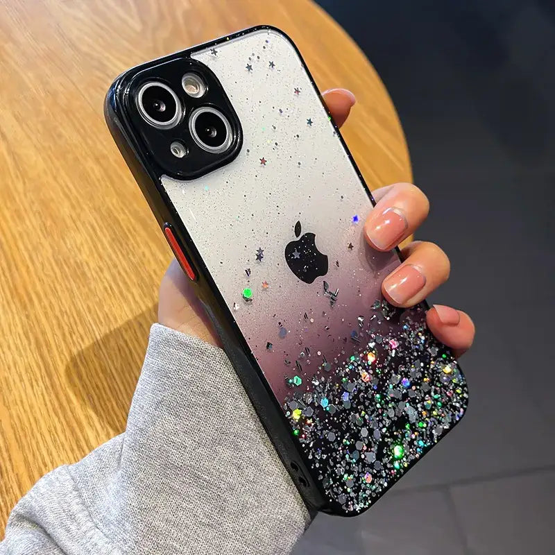 a person holding a phone case with glitter on it