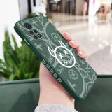 A person holding a phone case with a green and white design