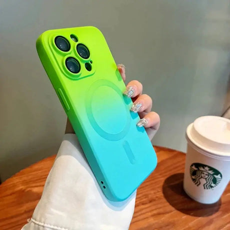 A person holding a phone case with a green and blue gradient