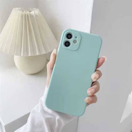 a person holding a phone case in their hand