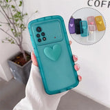 a person holding a phone case with a heart on it