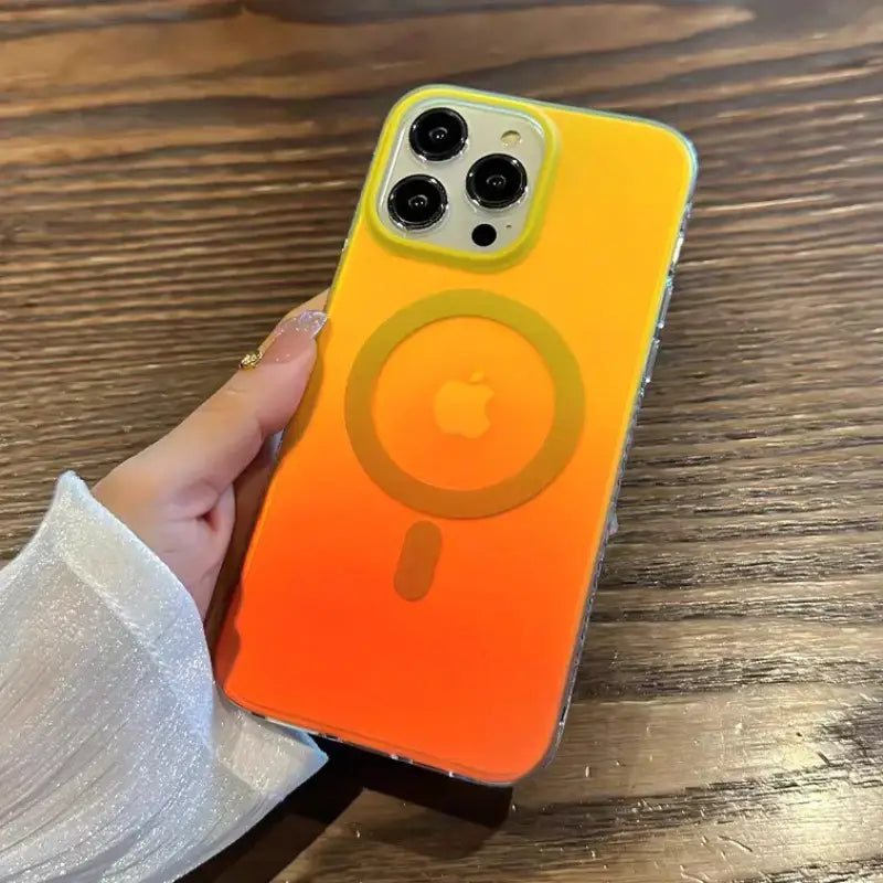 a person holding a phone case with an orange and yellow color