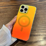 A person holding a phone case with an orange and yellow color