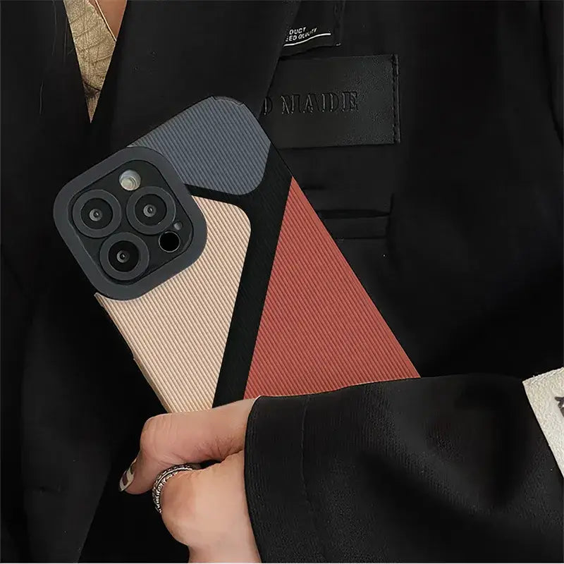 a person holding a phone case with a phone in it