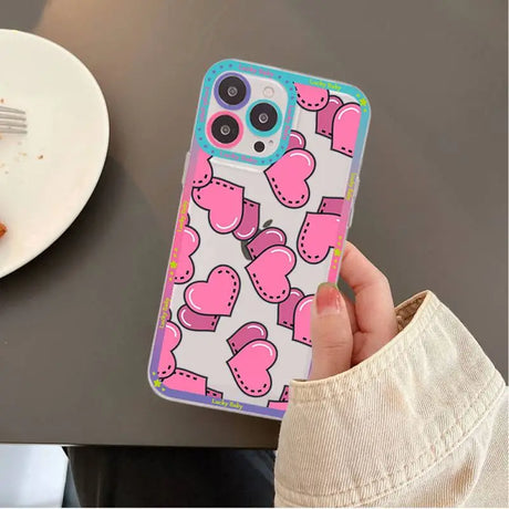 A person holding a phone case with a pattern on it