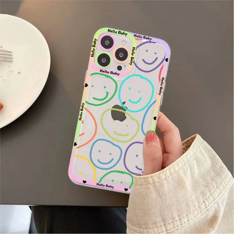 A person holding a phone case with a pattern on it