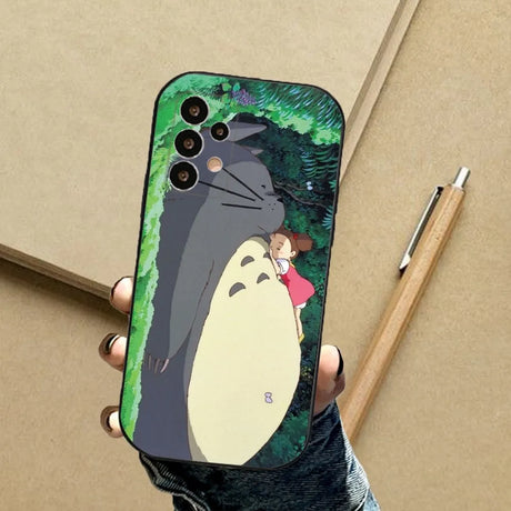 A person holding a phone case with a penguin on it