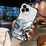 a person holding a phone case with a photo of a mountain