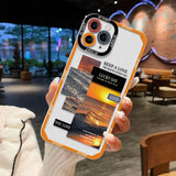 A person holding a phone case with a photo of a sunset