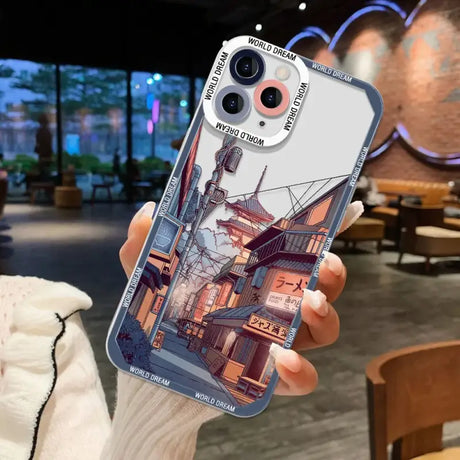 A person holding a phone case with a picture of a city