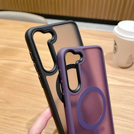 A person holding a phone case with a purple circle on it