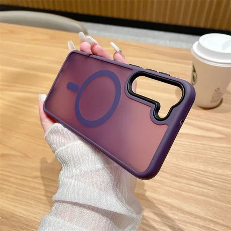 A person holding a phone case with a purple phone