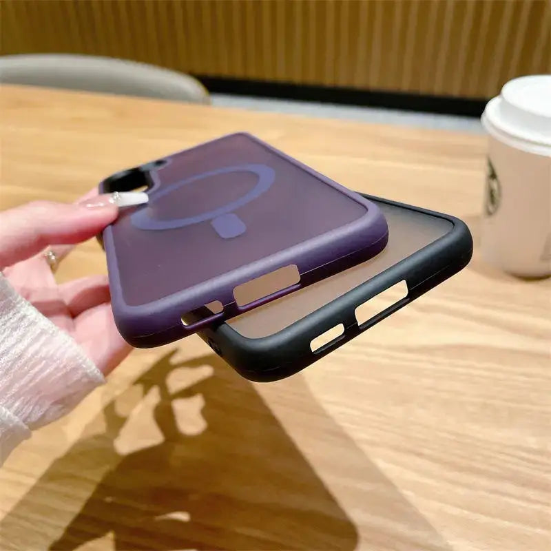 a person holding a phone case with a purple cover