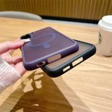 a person holding a phone case with a purple cover