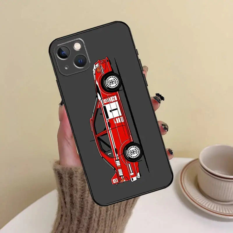 a person holding a phone case with a red car