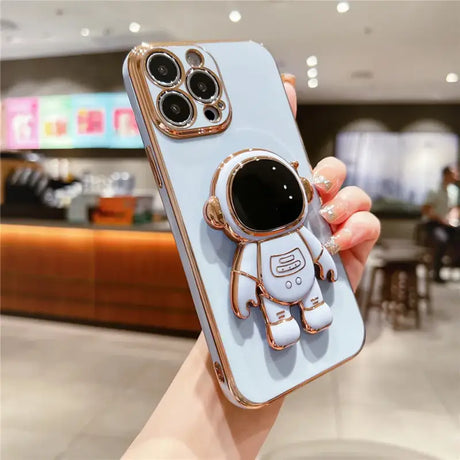 A person holding a phone case with a robot on it