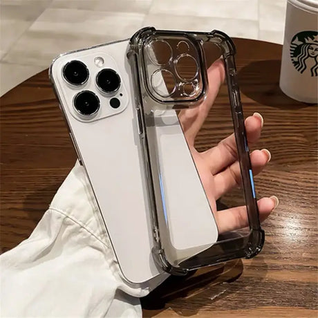 A person holding a phone case with a starbucks cup in the background
