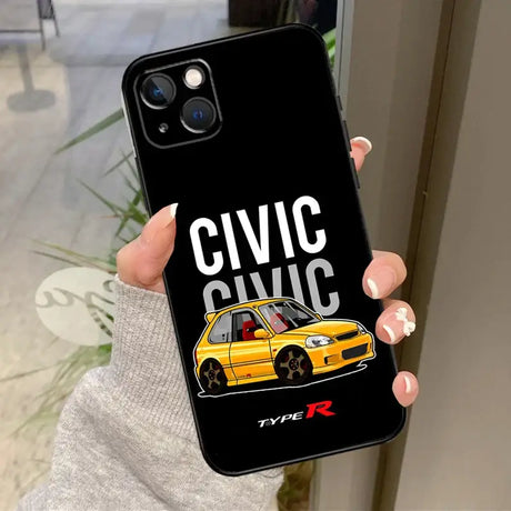 A person holding a phone case with a yellow car