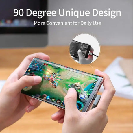 A person holding a phone with a game controller