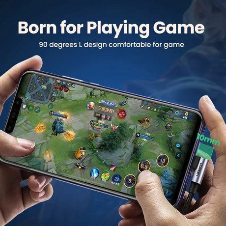 A person holding a phone with a game on it