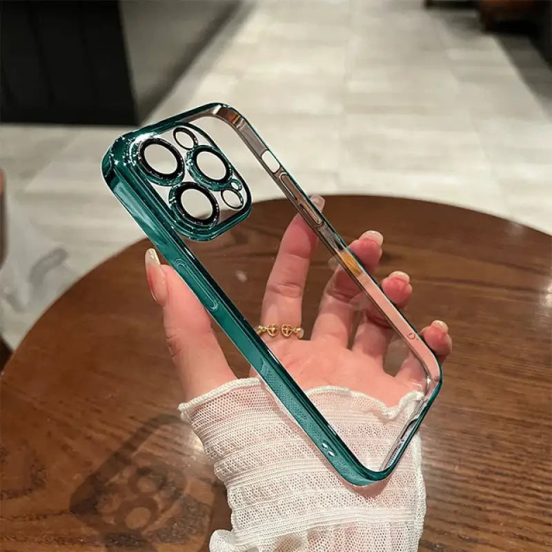 a person holding a phone with a green case