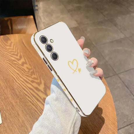 a person holding a phone with a heart on it