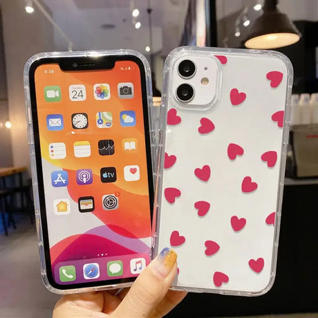 A person holding a phone with hearts on it