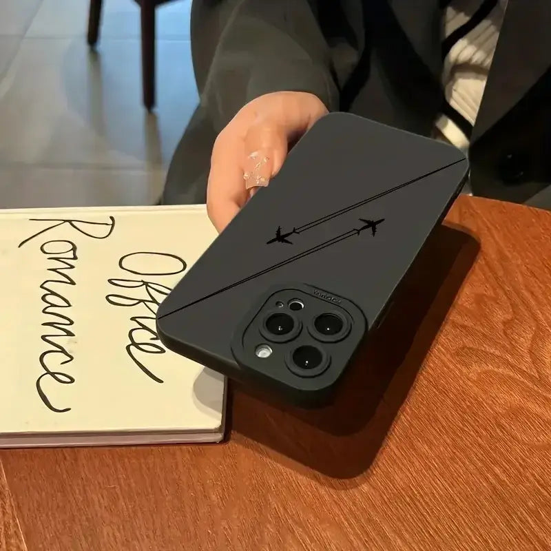 a person holding a phone with a note on it