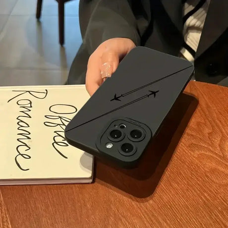 A person holding a phone with a note on it