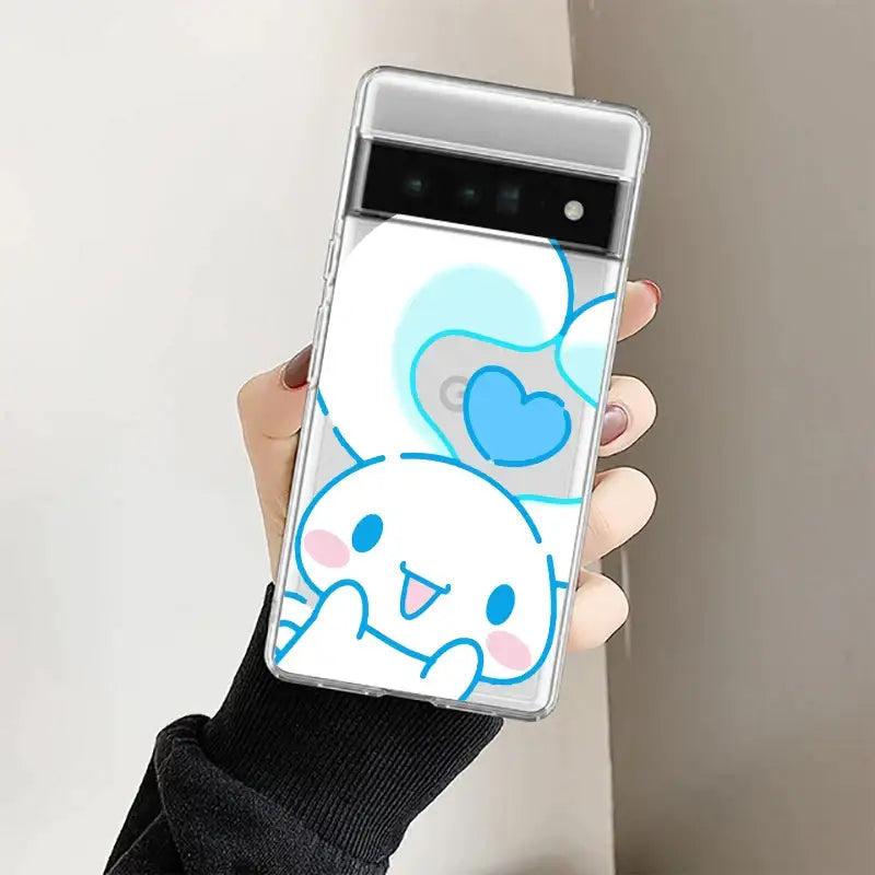 A person holding a phone with a pokemon sticker on it