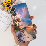a person holding a phone with a sunset photo on it