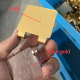 a person holding a piece of gold in their hand