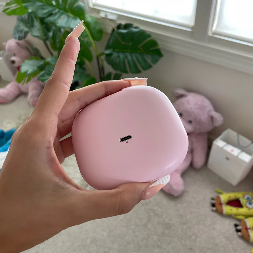 a person holding a pink alarm clock