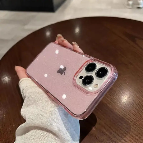 a person holding a pink iphone case