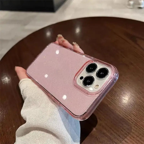 a person holding a pink iphone case