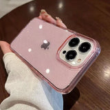 a person holding a pink iphone case